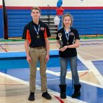 archers with medals and trophy